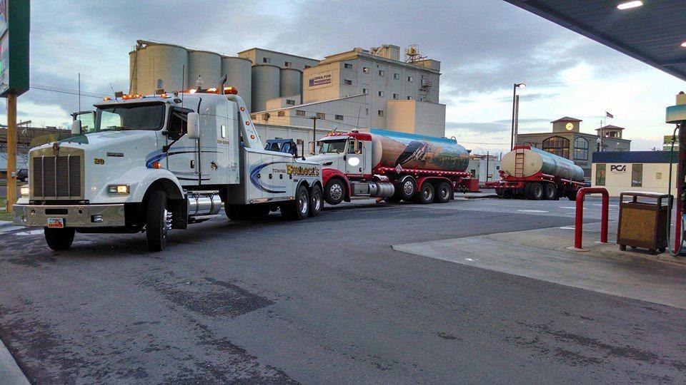 commercial tanker truck being towed