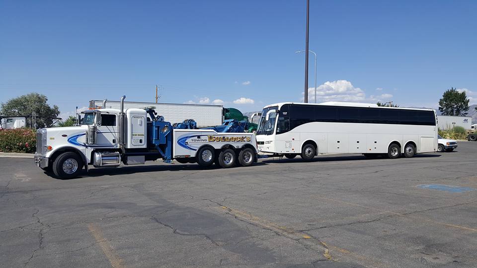 image of white bus being towed by bullocks towing