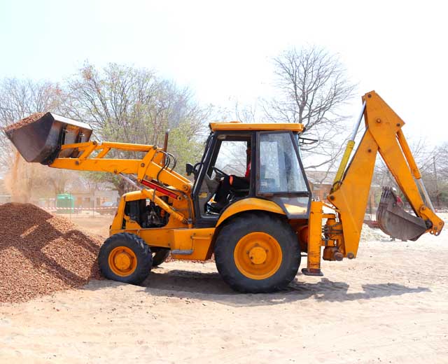 transporting heavy backhoe equipment